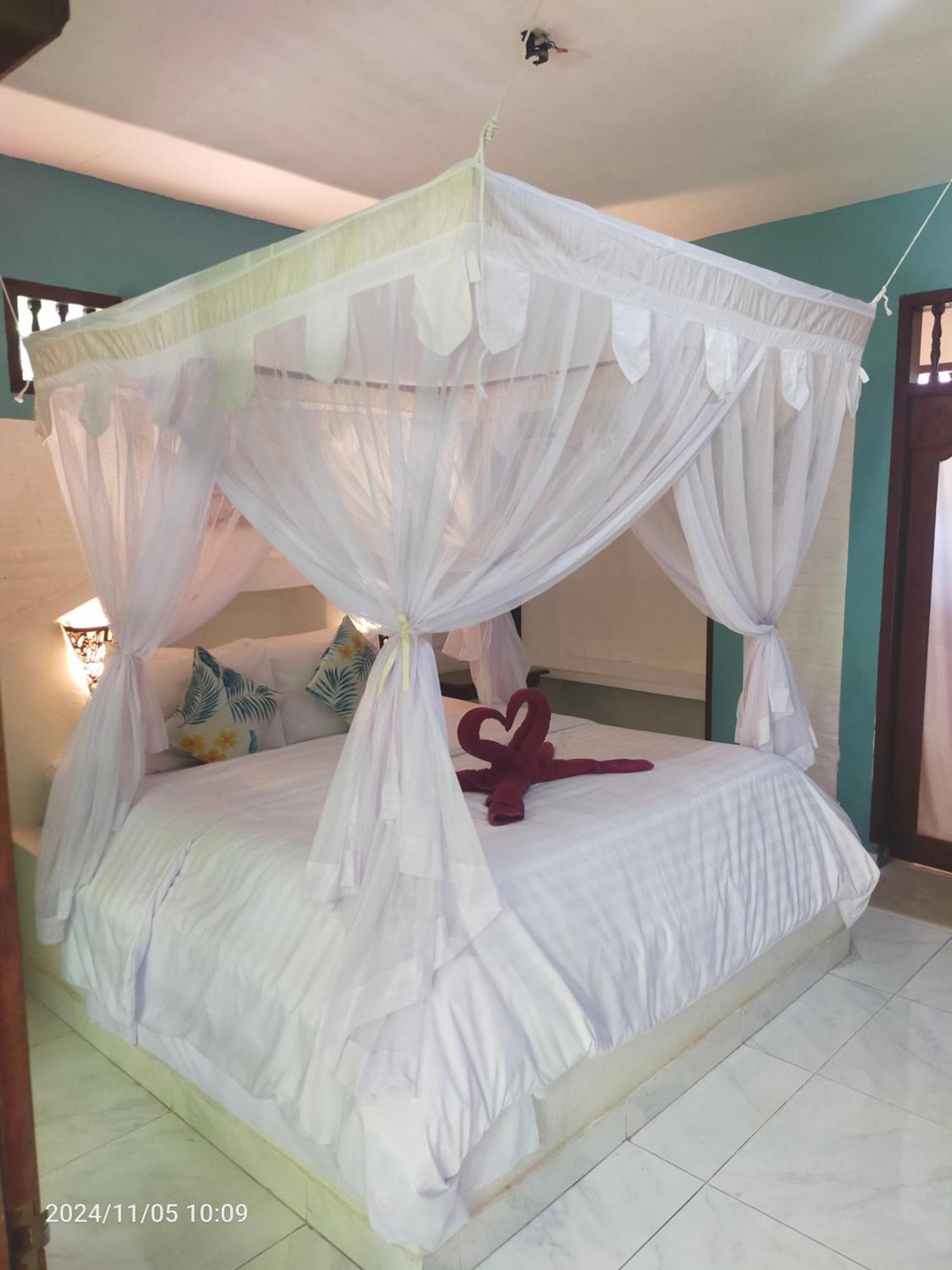Puri Oka Beach Bungalows จันดีดาซา ภายนอก รูปภาพ