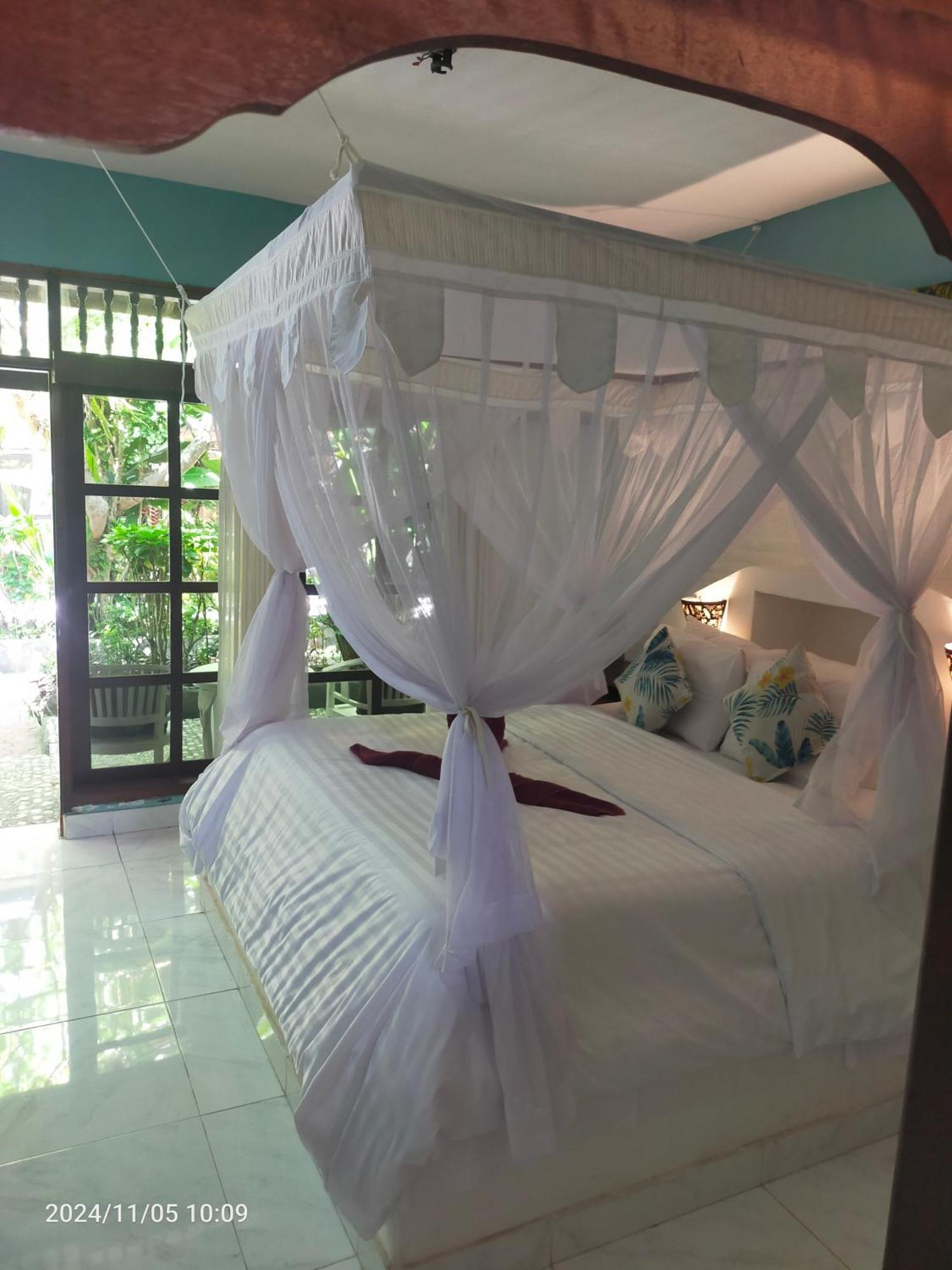 Puri Oka Beach Bungalows จันดีดาซา ภายนอก รูปภาพ